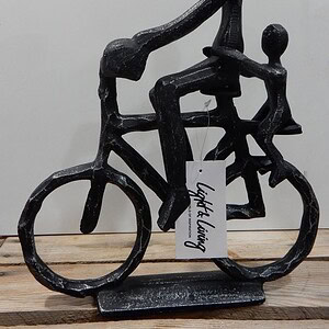 Beeld fiets vrouw met kind